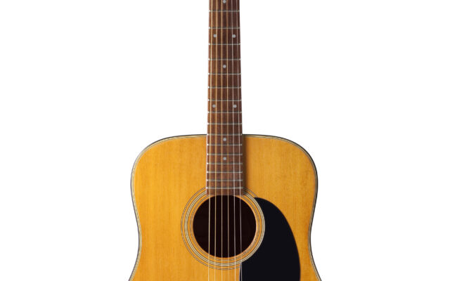 An acoustic guitar once owned by John Lennon is on the block